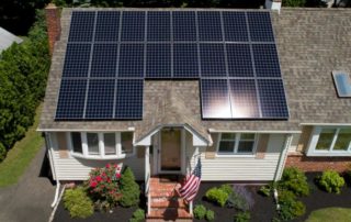 Aerial view of Evergreen Residential Solar array on a house rooftop.