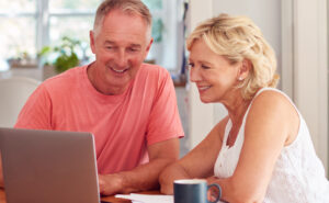 Couple Exploring Solar Options Online with Home & Energy Solutions of Florida for a Sustainable Future Couple Exploring Solar Options Online with Home & Energy Solutions of Florida for a Sustainable Future