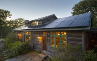 Front view of home with solar panels covering the rooftop