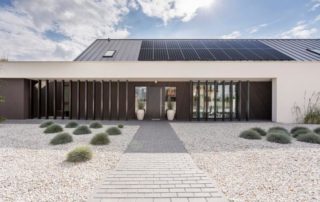 Front view of a home with Evergreen Residential Solar array on a house rooftop.