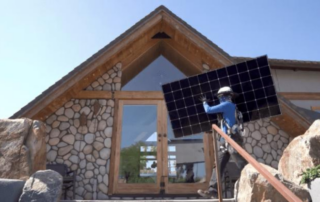 Technician installing a solar panel on a modern home, showcasing future solar innovations by Home & Energy Solutions of Florida.