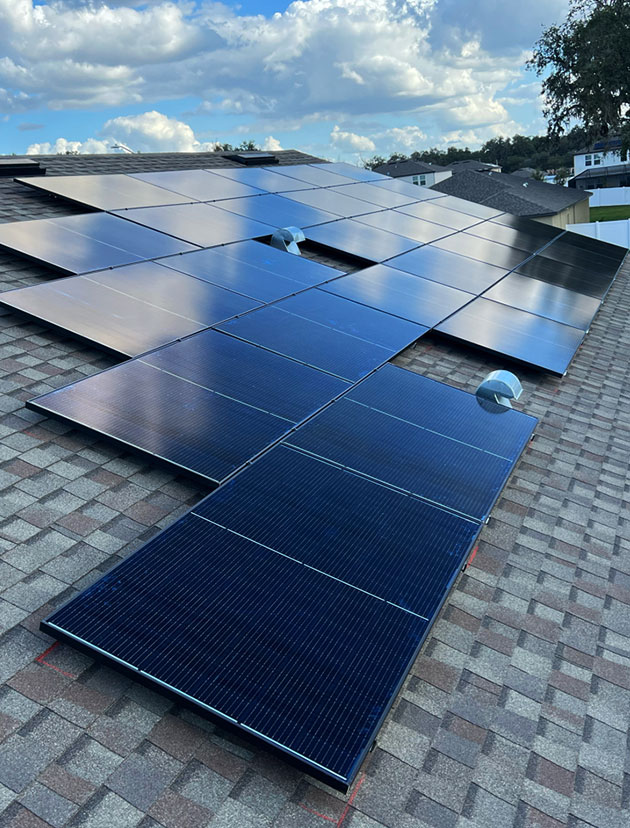 Rooftop solar panel installation on a residential home in Florida by Home & Energy Solutions of Florida, showcasing clean energy