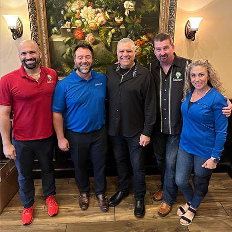 Home & Energy Solutions of Florida team at company event supporting solar initiatives.