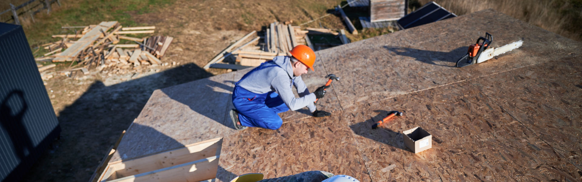 Roofing contractor installing a new energy-efficient roof system on a Florida home during renovation.